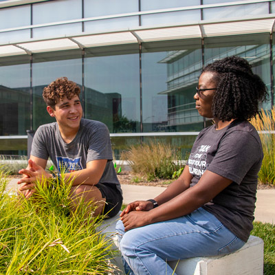 Two students talk one-on-one
