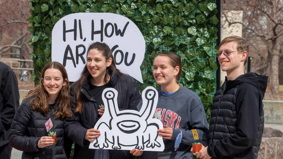 Student participate in the Hi, How Are You? event outside the Nebraska Union.