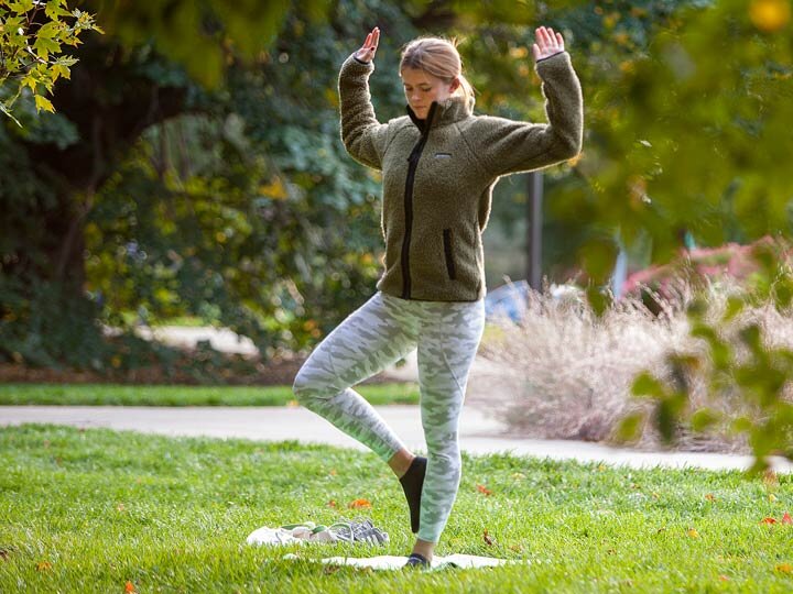 Person doing yoga outdoors